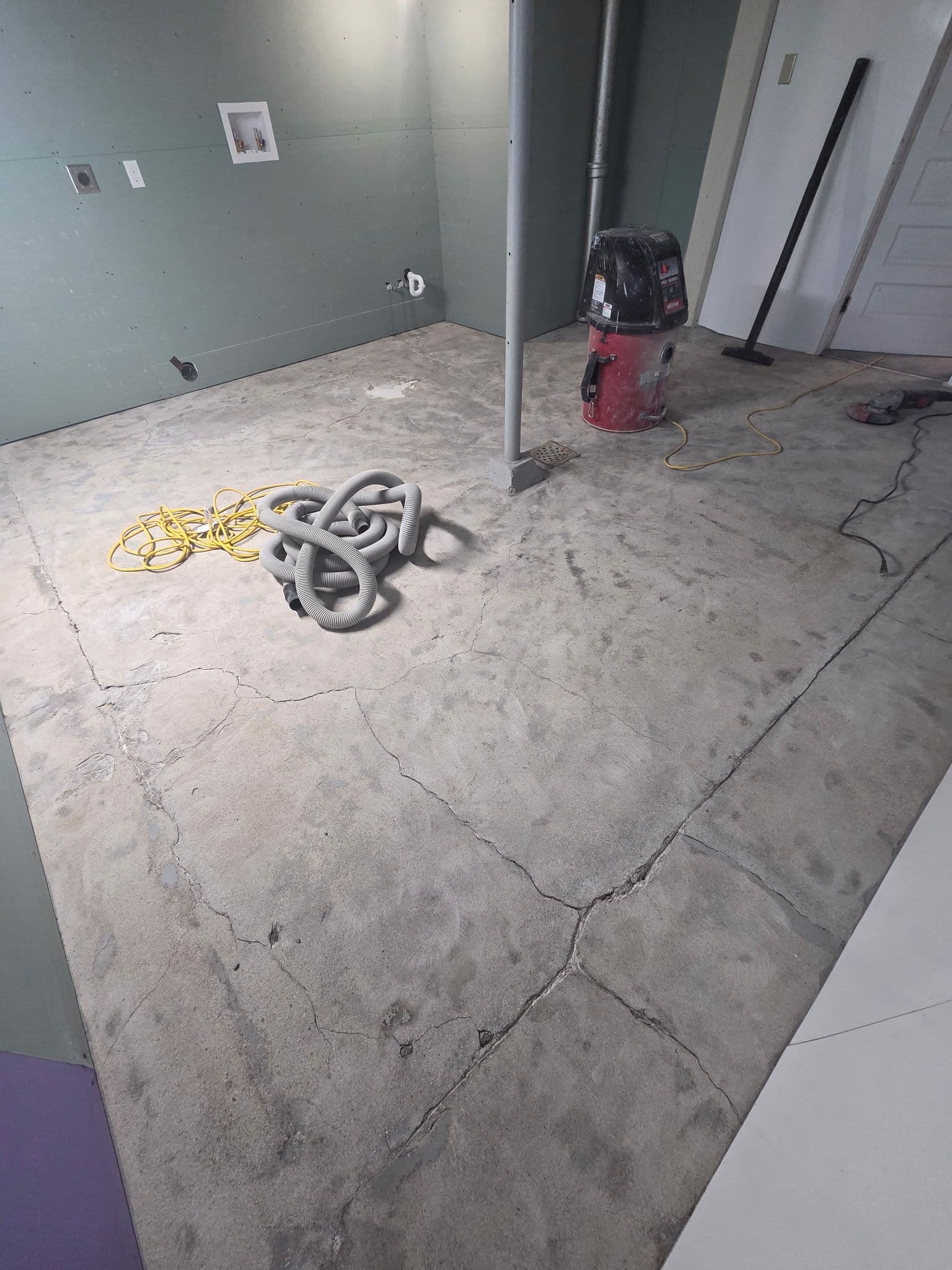 Gallery photos for Cracked Laundry Room Floor Gets a Full Flake Epoxy Finish in Lakeville: Image #1